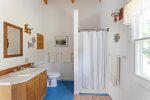 King EnSuite bathroom with stall shower and laundry